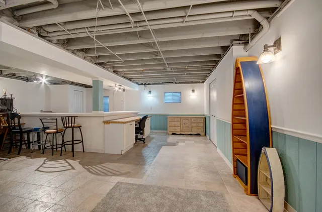 a view of a hallway with seating area