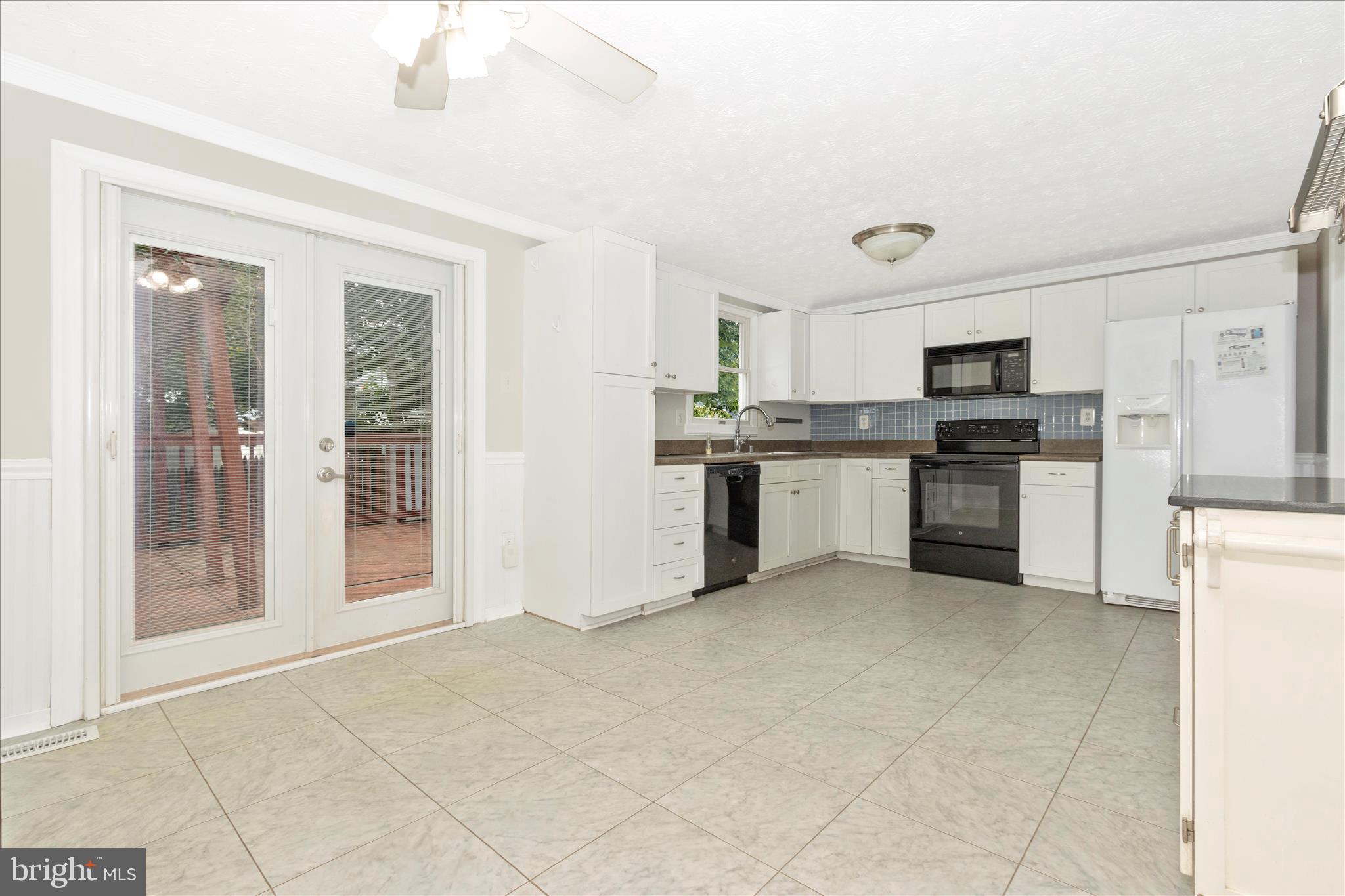 207 Contour Road Mount Airy, MD 21771 - Photo 15 of 52 a large kitchen with cabinets and stainless steel appliances