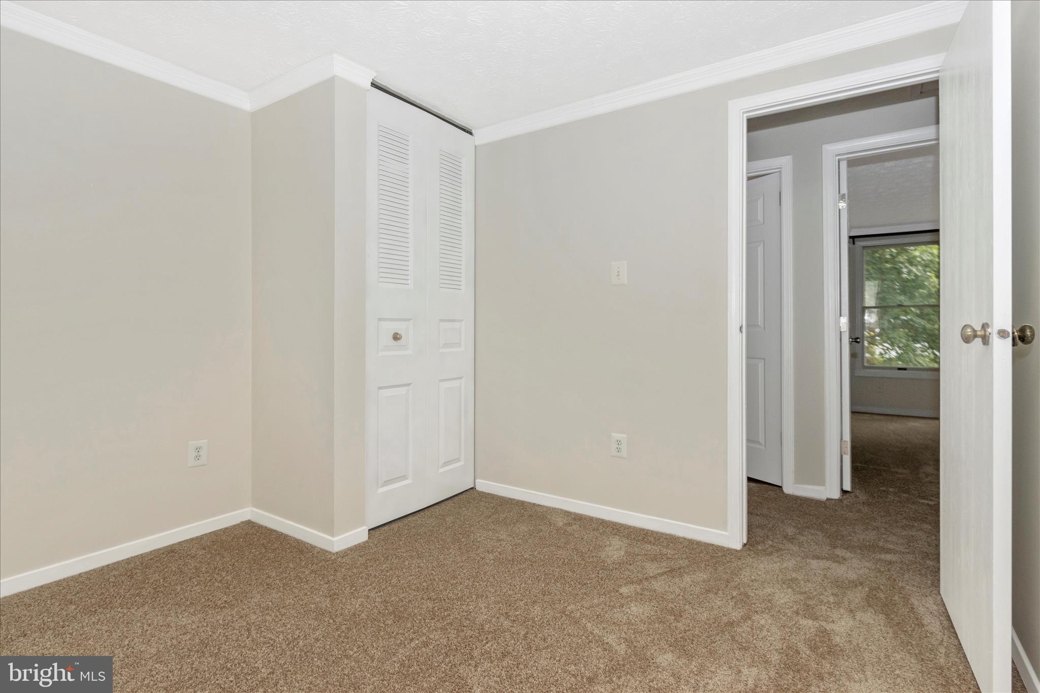 207 Contour Road Mount Airy, MD 21771 - Photo 22 of 52 an empty room with closet and a hallway