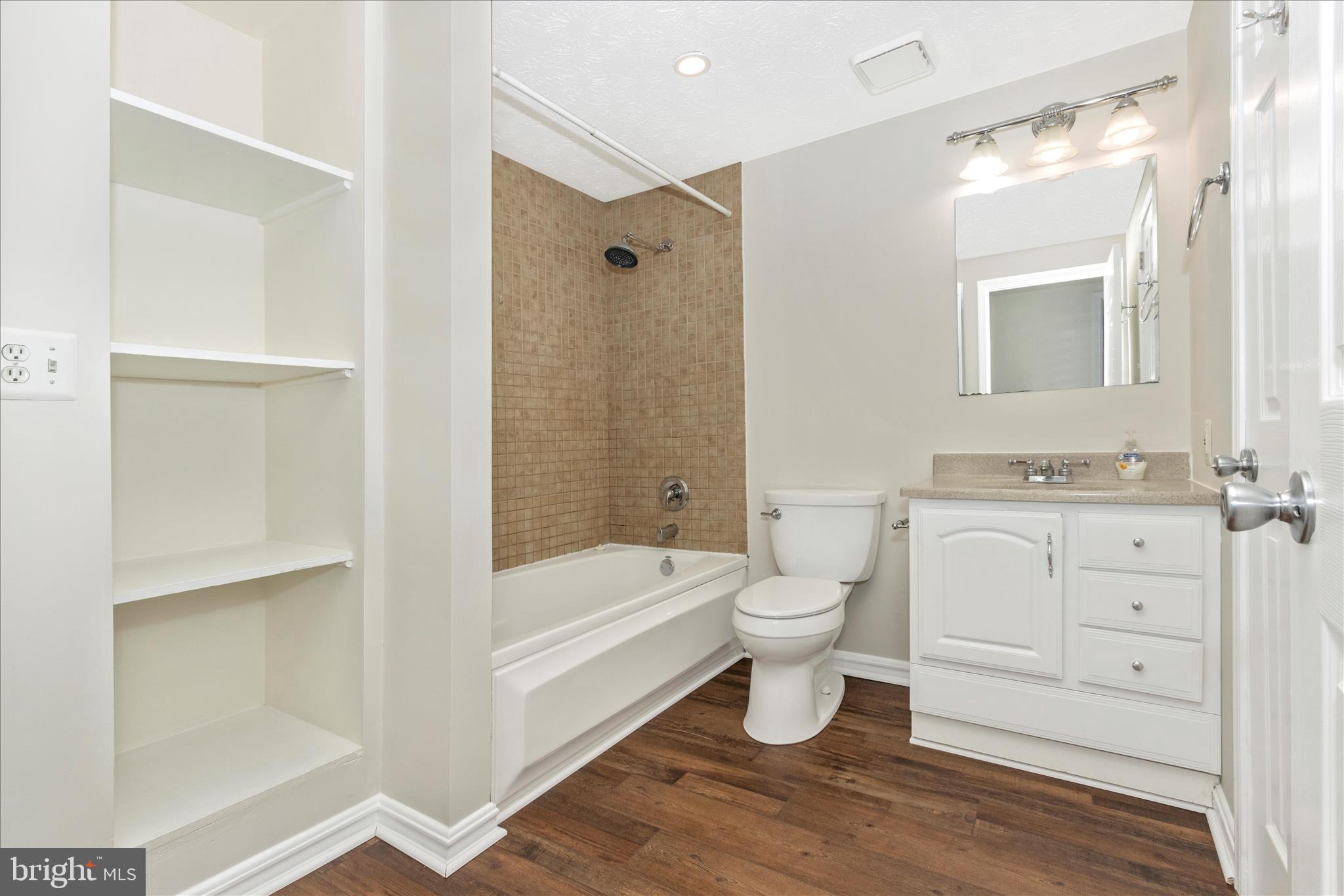 207 Contour Road Mount Airy, MD 21771 - Photo 25 of 52 a bathroom with a toilet a sink a mirror a bathtub and vanity