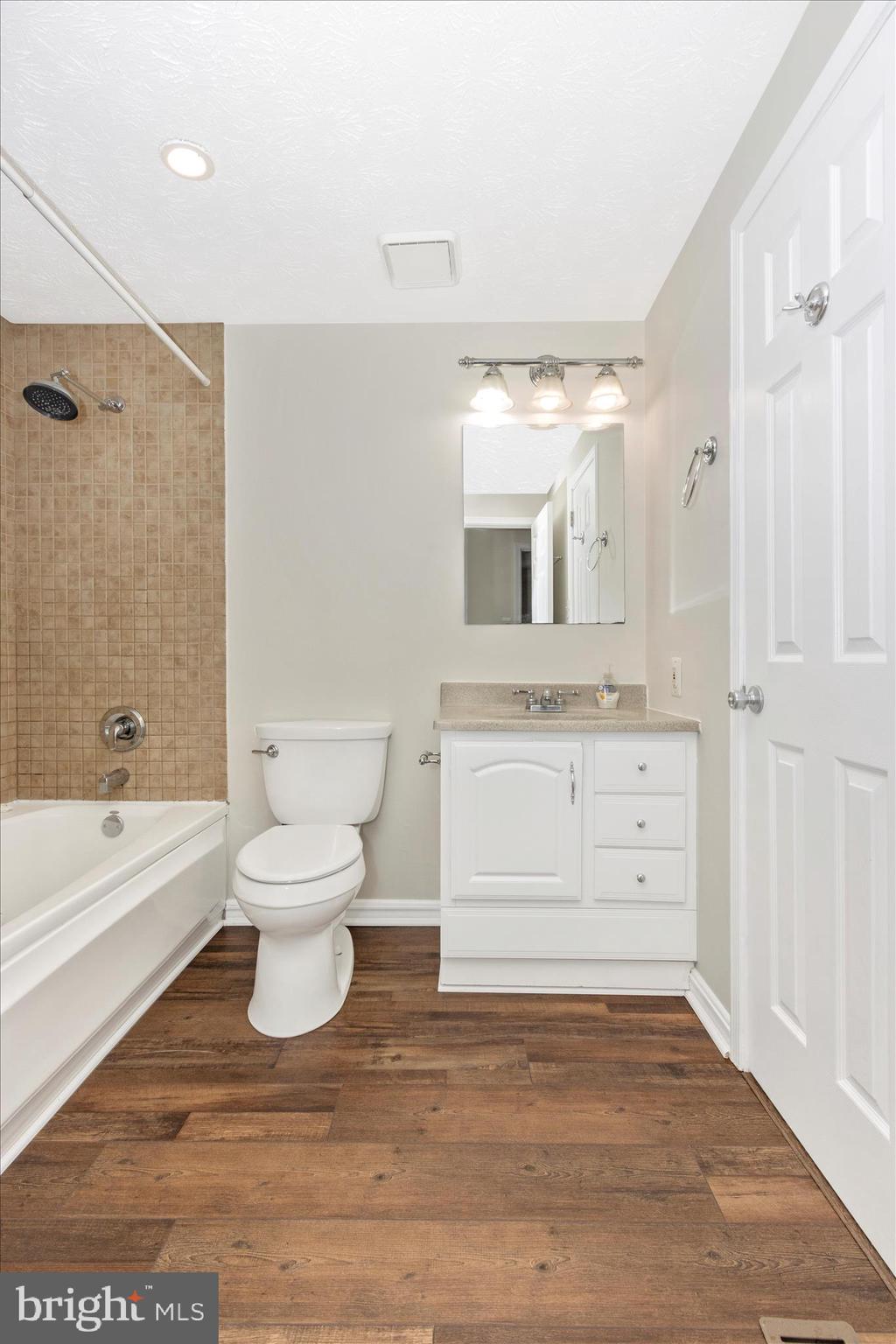 207 Contour Road Mount Airy, MD 21771 - Photo 26 of 52 a bathroom with a sink a toilet and a bathtub