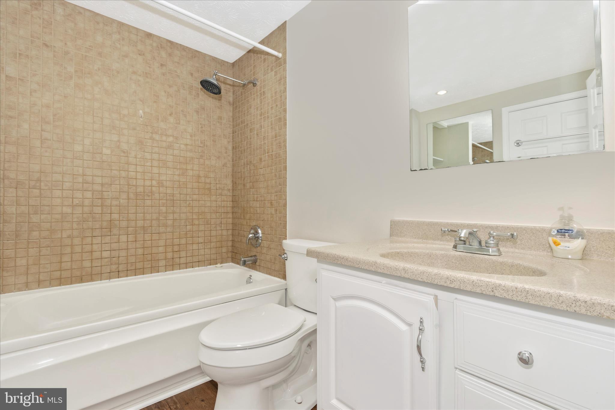 207 Contour Road Mount Airy, MD 21771 - Photo 27 of 52 a bathroom with a granite countertop bathtub shower sink vanity and toilet