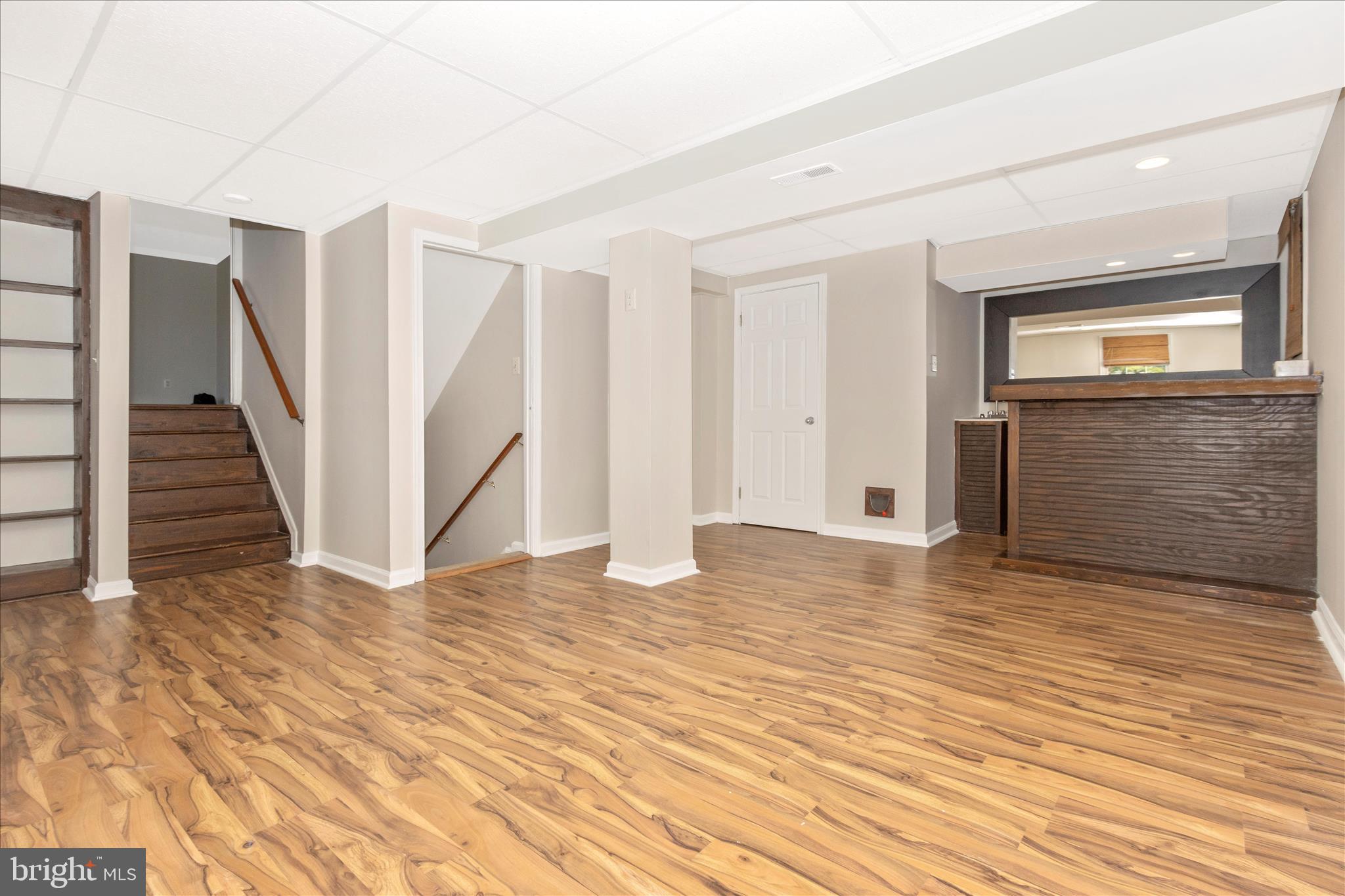 207 Contour Road Mount Airy, MD 21771 - Photo 29 of 52 a view of an empty room with wooden floor and stairs
