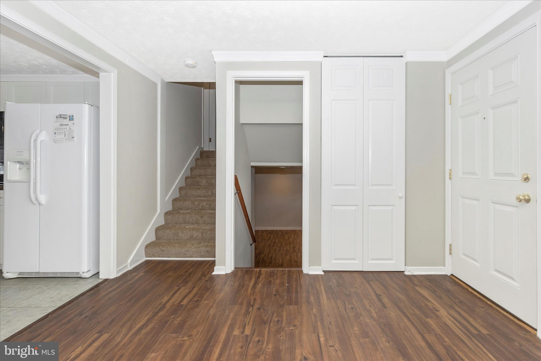 207 Contour Road Mount Airy, MD 21771 - Photo 3 of 52 a view of a hallway with wooden floor and entryway