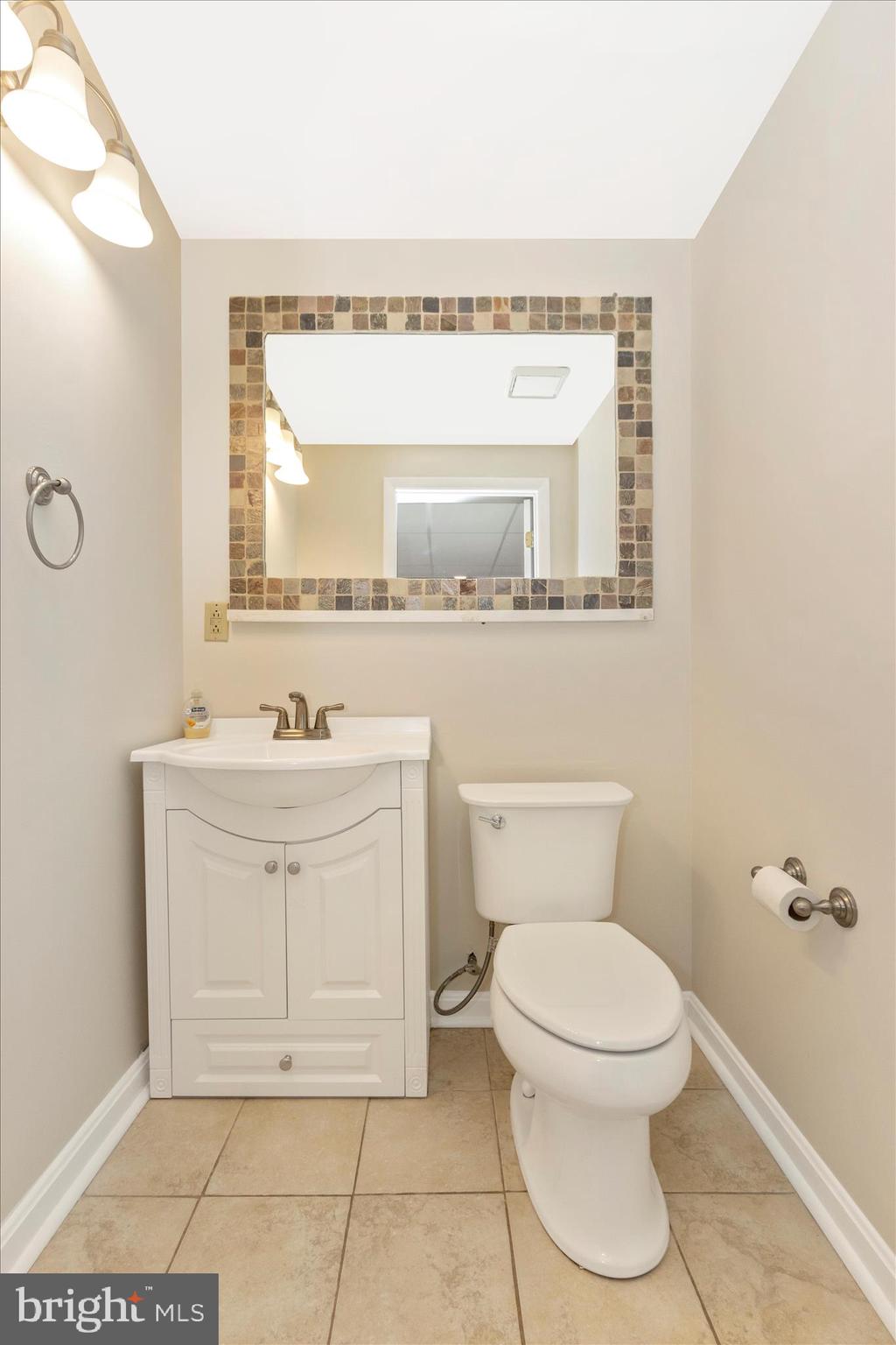 207 Contour Road Mount Airy, MD 21771 - Photo 32 of 52 a bathroom with a sink a toilet and mirror