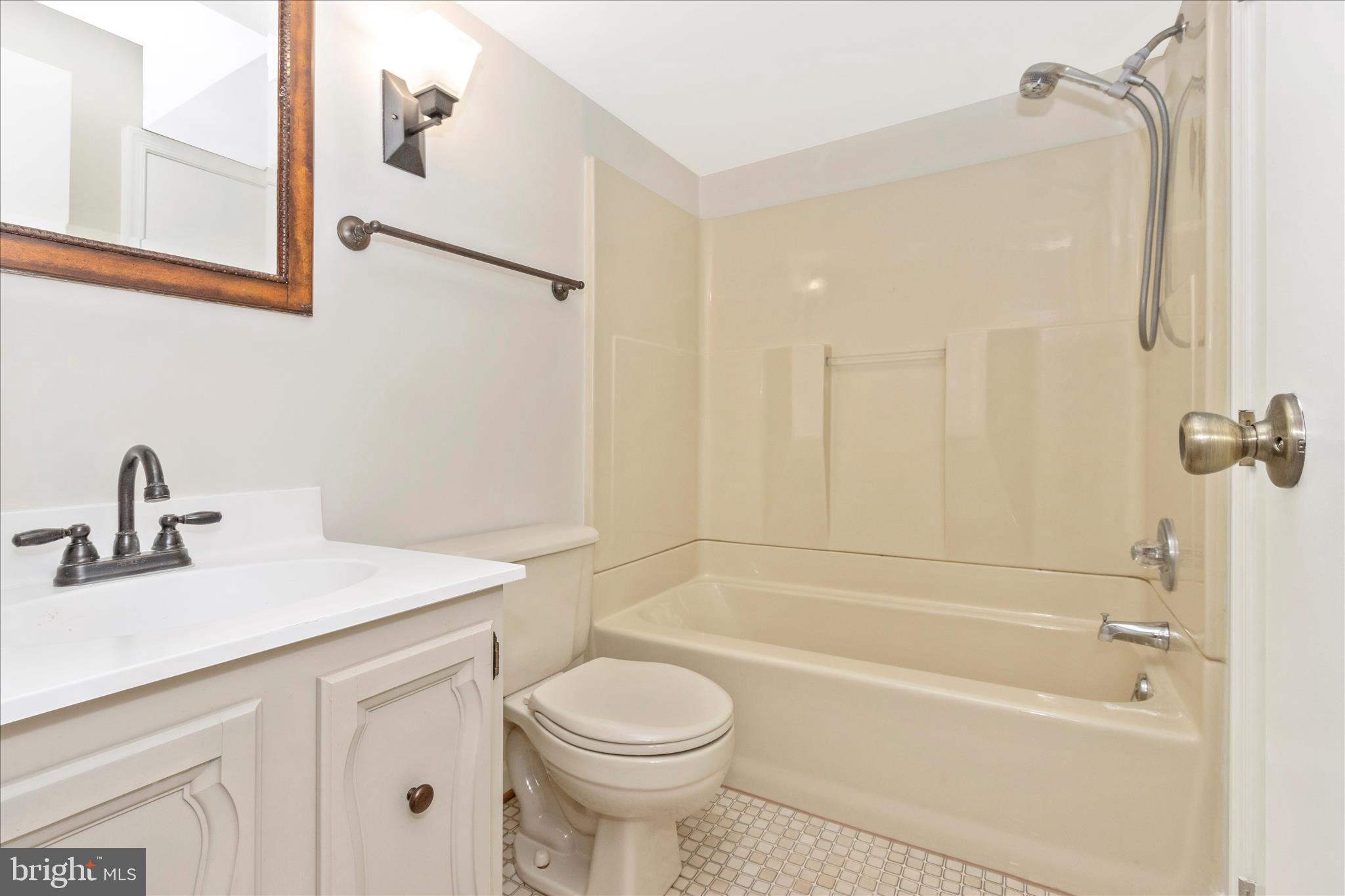207 Contour Road Mount Airy, MD 21771 - Photo 37 of 52 a bathroom with a sink a toilet and shower