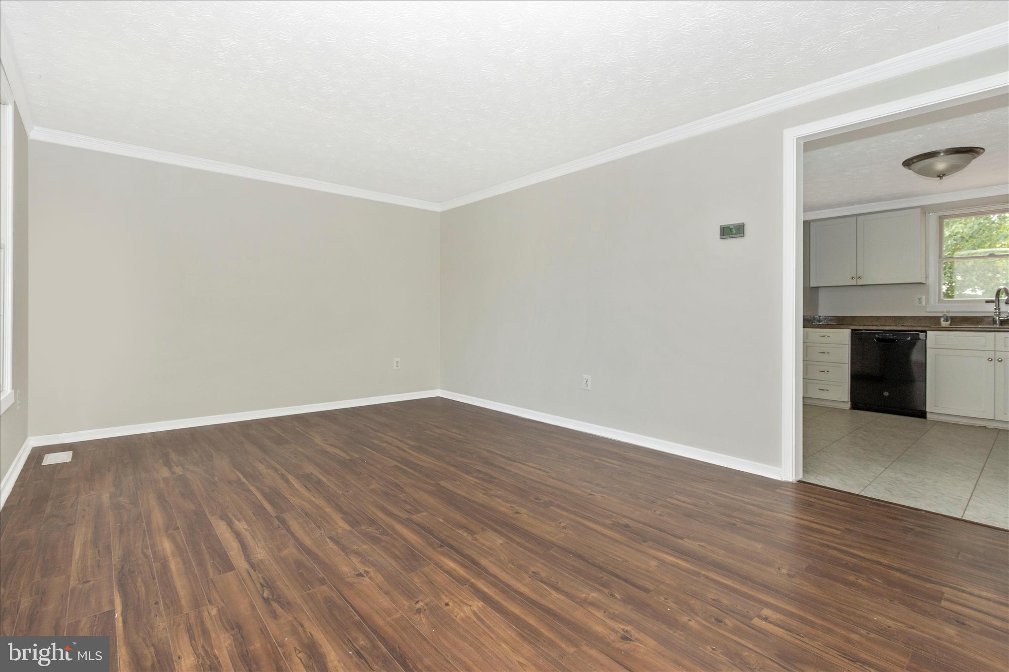 207 Contour Road Mount Airy, MD 21771 - Photo 4 of 52 a view of a room with wooden floor and a sink