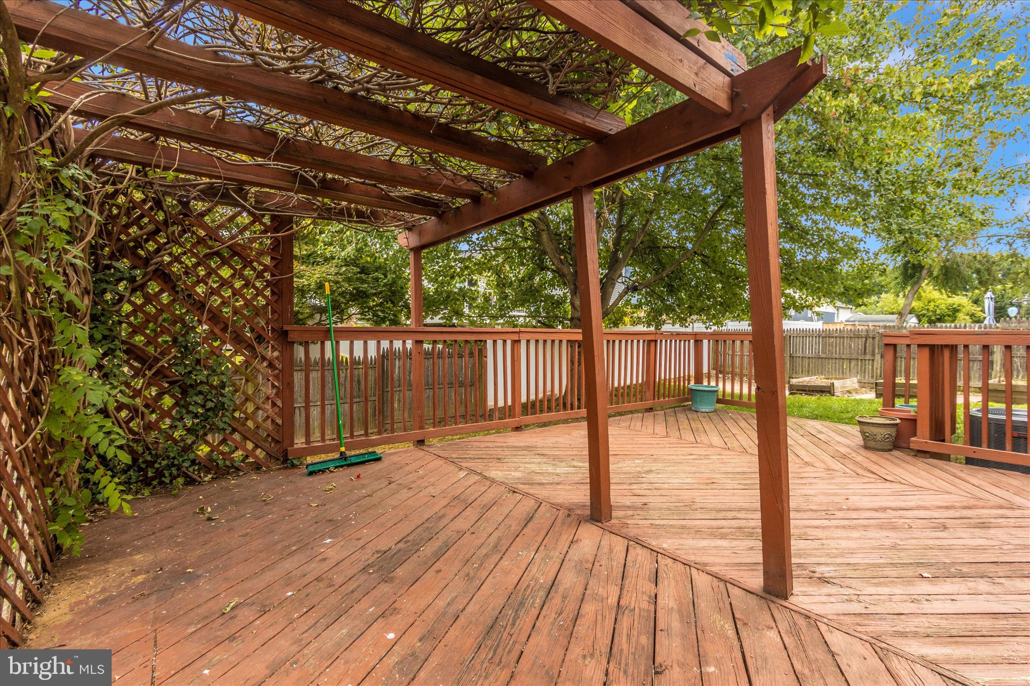 207 Contour Road Mount Airy, MD 21771 - Photo 46 of 52 a porch with wooden floor in front of a house