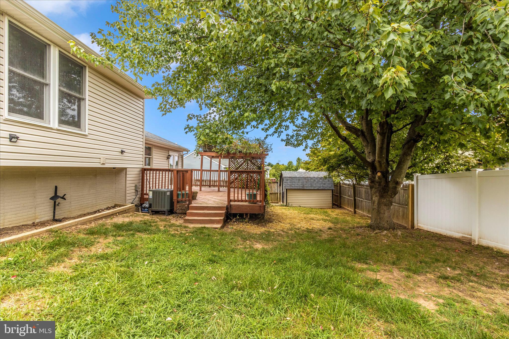 207 Contour Road Mount Airy, MD 21771 - Photo 50 of 52 a view of a backyard with a large tree