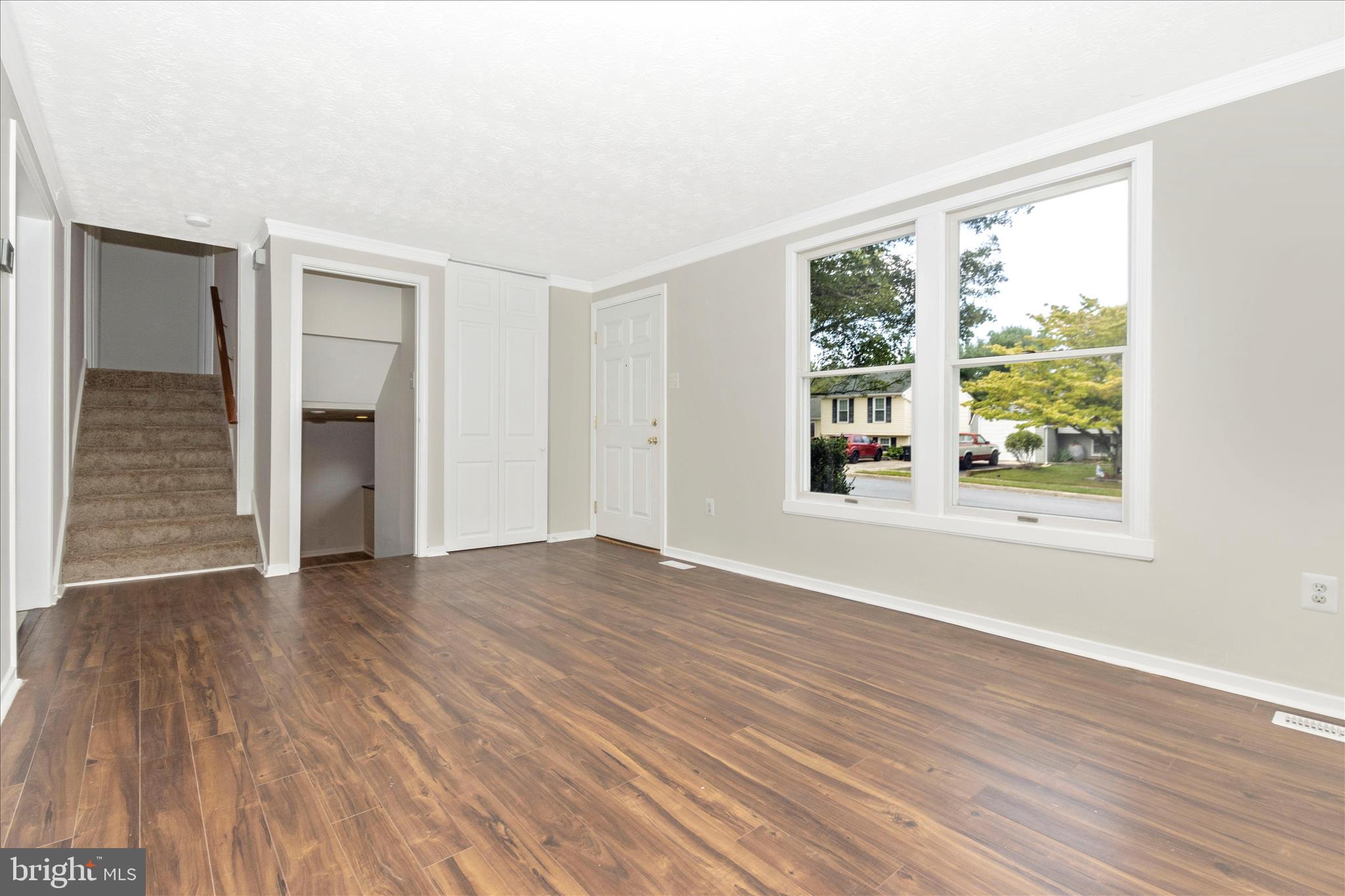 207 Contour Road Mount Airy, MD 21771 - Photo 6 of 52 a view of an empty room with wooden floor and a window