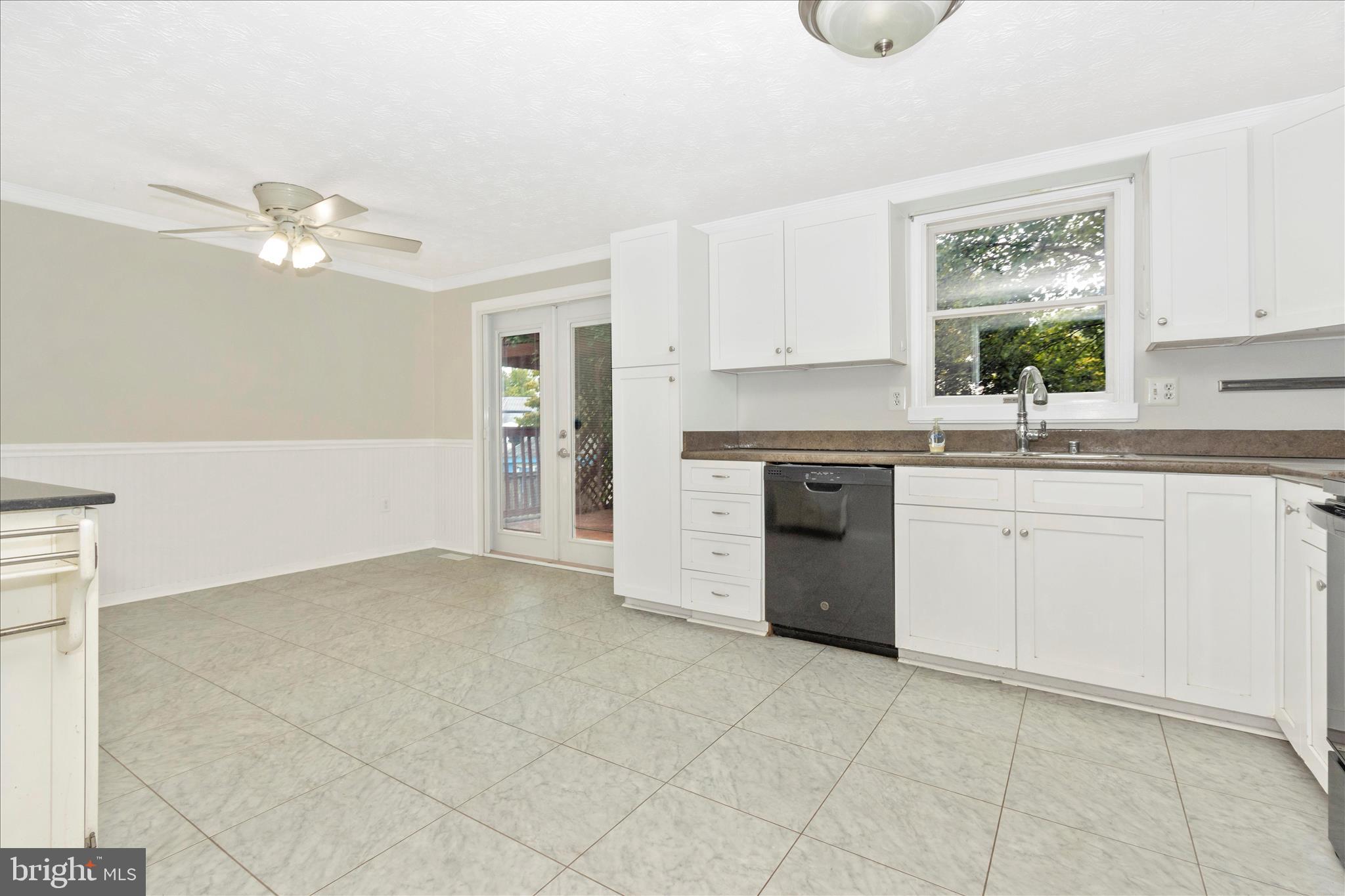 207 Contour Road Mount Airy, MD 21771 - Photo 9 of 52 a kitchen with cabinets stainless steel appliances and a window