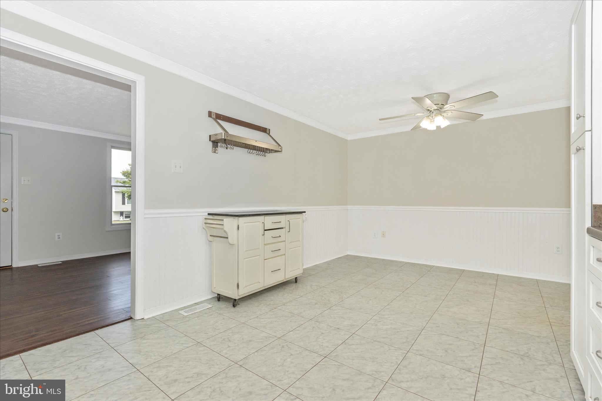 207 Contour Road Mount Airy, MD 21771 - Photo 10 of 52 an empty room with windows and fan