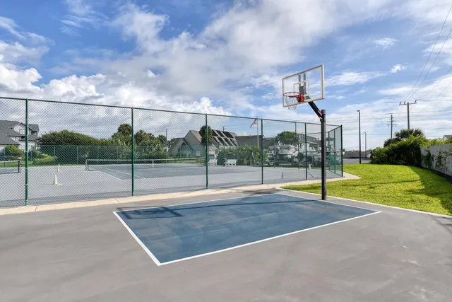 a view of an outdoor space and tennis court