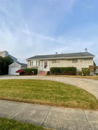 a front view of a house with swimming pool
