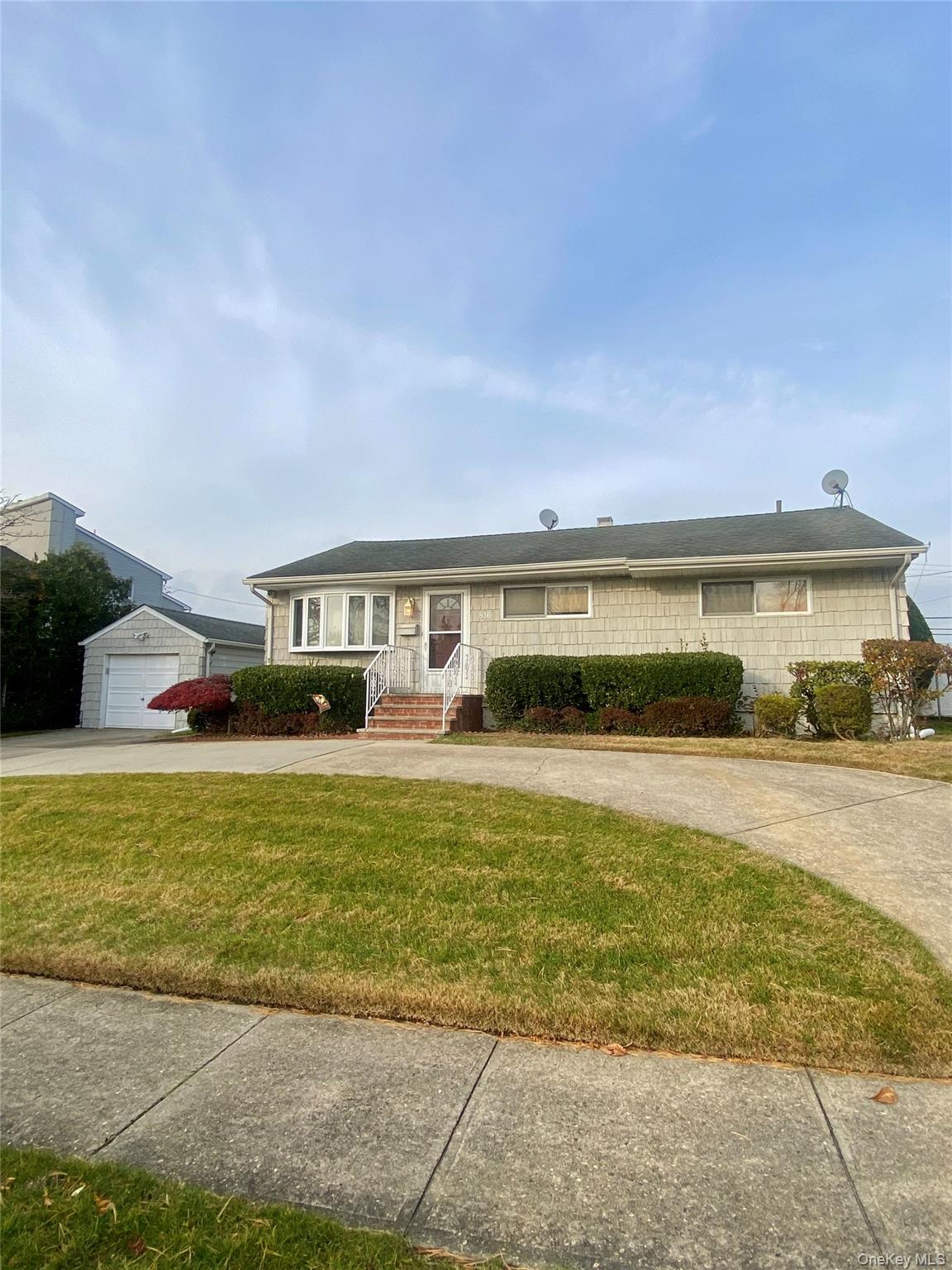 a front view of a house with swimming pool