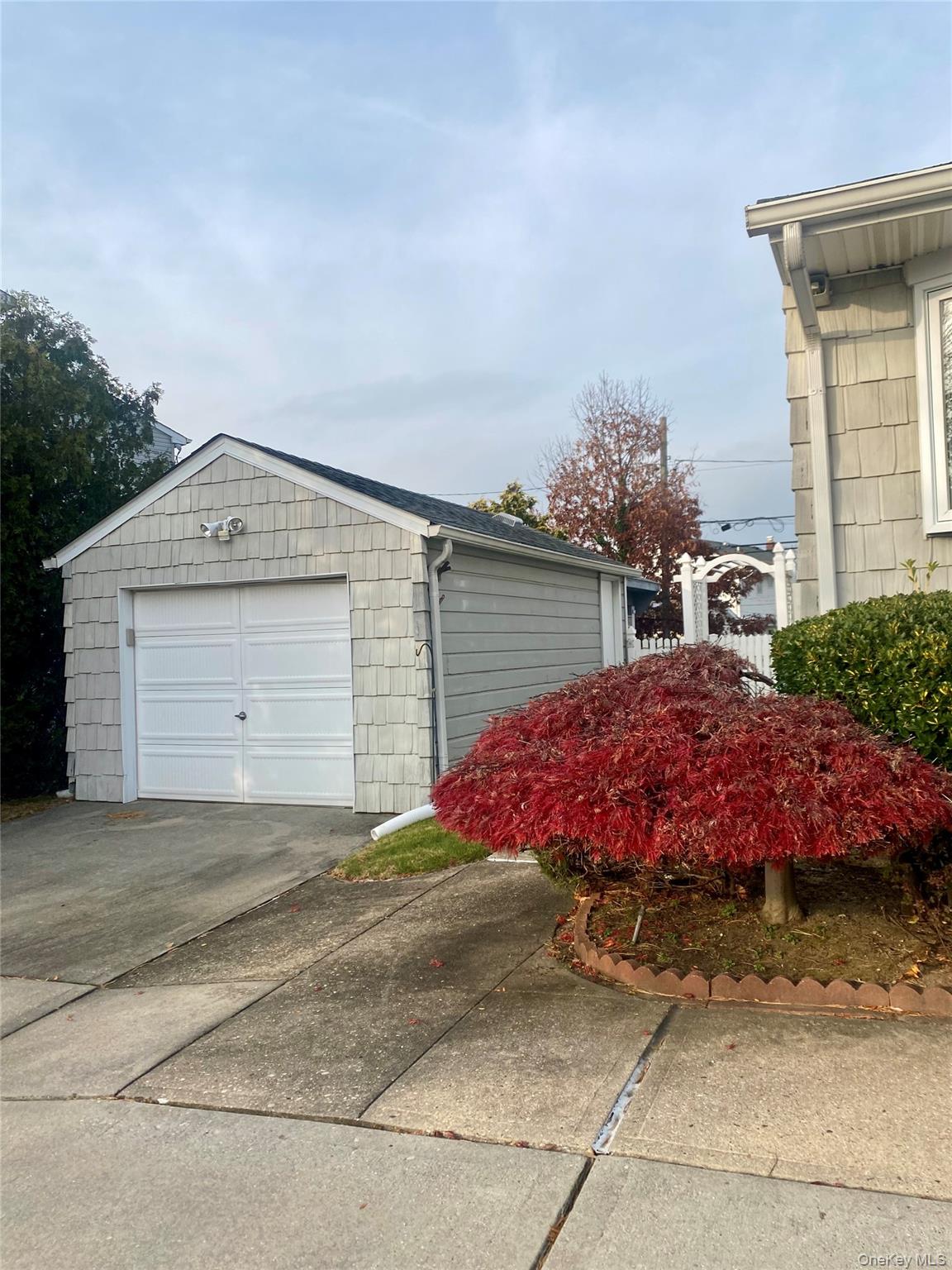 816 Anderson Avenue Franklin Square, NY 11010 - Photo 4 of 11 a front view of a house with a yard