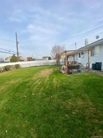 a view of a terrace with a big yard