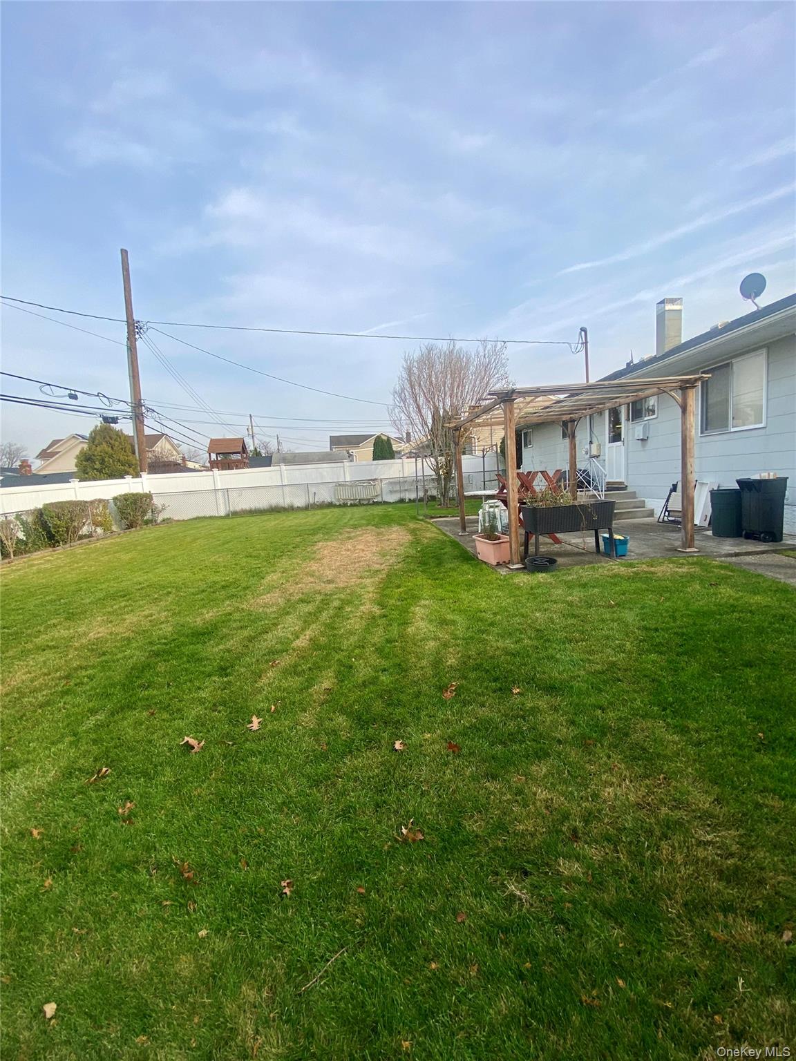 816 Anderson Avenue Franklin Square, NY 11010 - Photo 5 of 11 a view of a terrace with a big yard