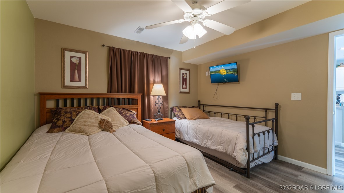 108 Park Pl Drive, Unit 1B Kaiser, MO 65047 - Photo 12 of 28 Guest Bedroom with access door to guest bathroom.