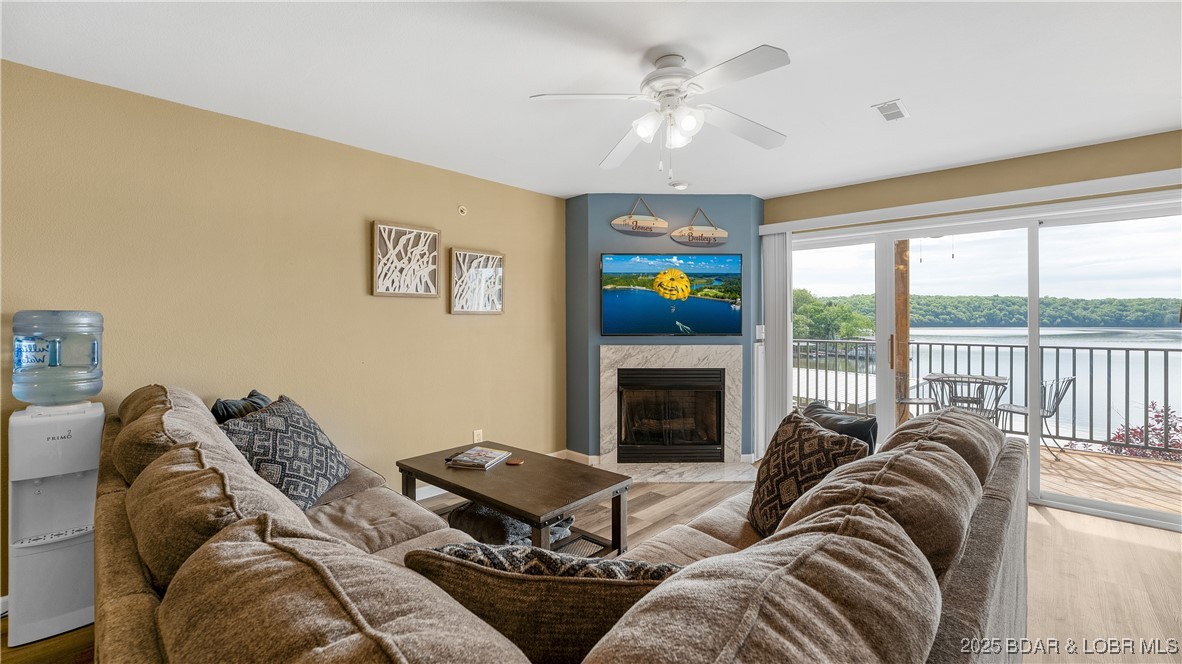 108 Park Pl Drive, Unit 1B Kaiser, MO 65047 - Photo 5 of 28 The sectional is new and super cozy!