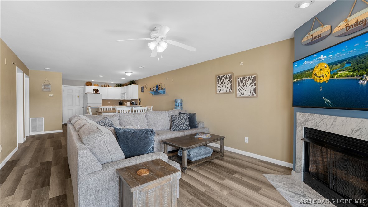108 Park Pl Drive, Unit 1B Kaiser, MO 65047 - Photo 6 of 28 This well-maintained condo has new LVP flooring.