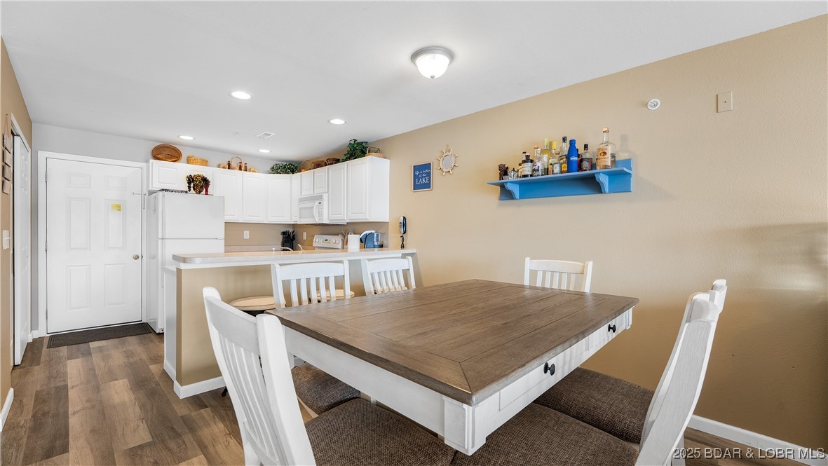 108 Park Pl Drive, Unit 1B Kaiser, MO 65047 - Photo 7 of 28 Nice sized area for dining table.