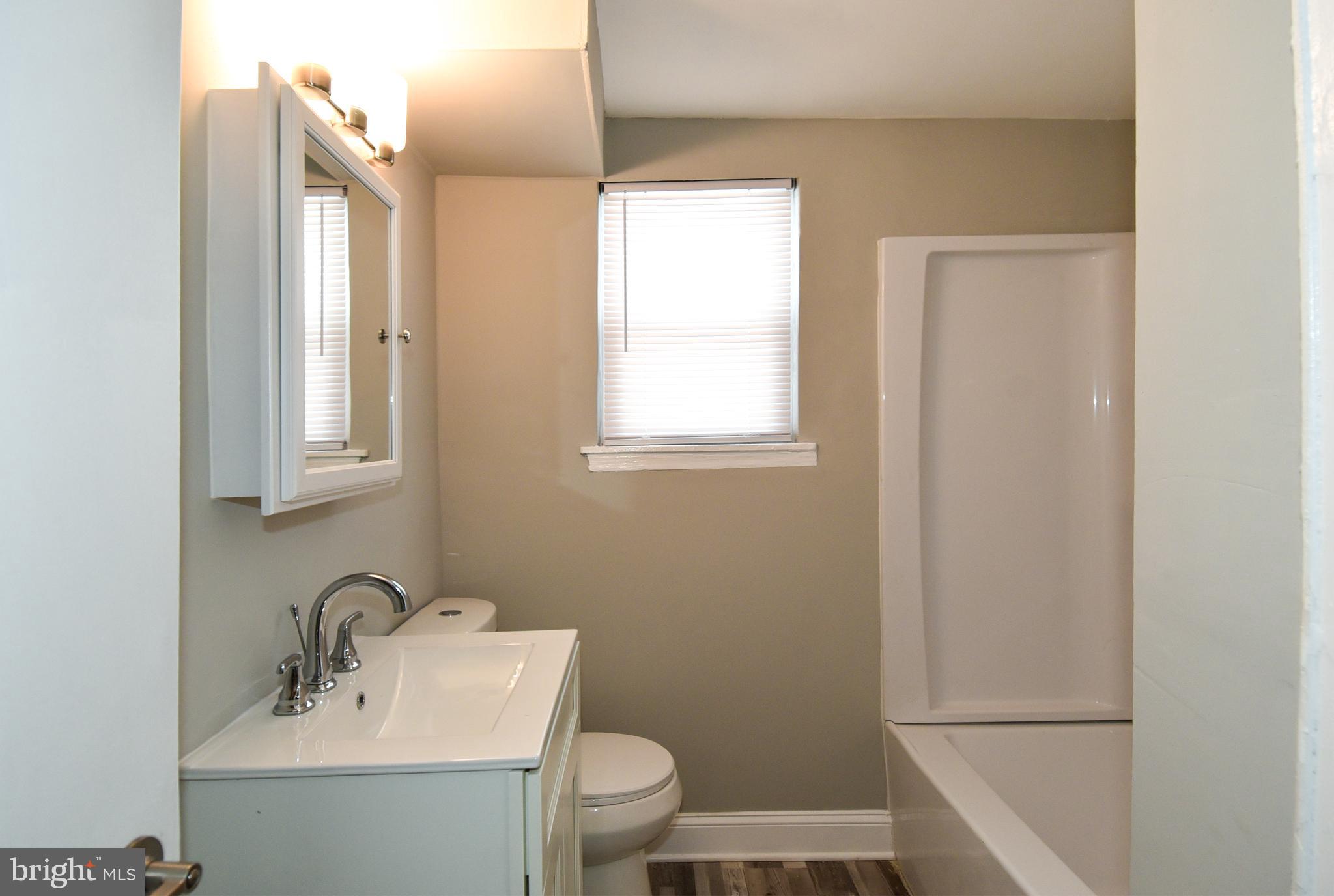 8208 Bellefonte Lane, Unit 5 Clinton, MD 20735 - Photo 14 of 17 Bright and airy bathroom with modern fixtures.