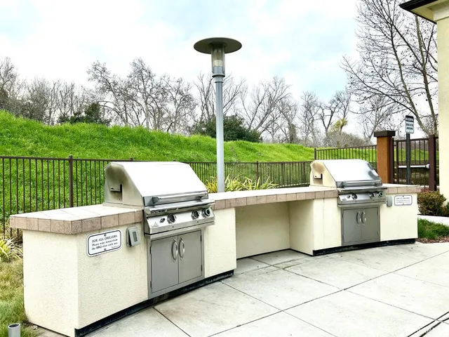 a view of a livingroom with furniture and gym equipment
