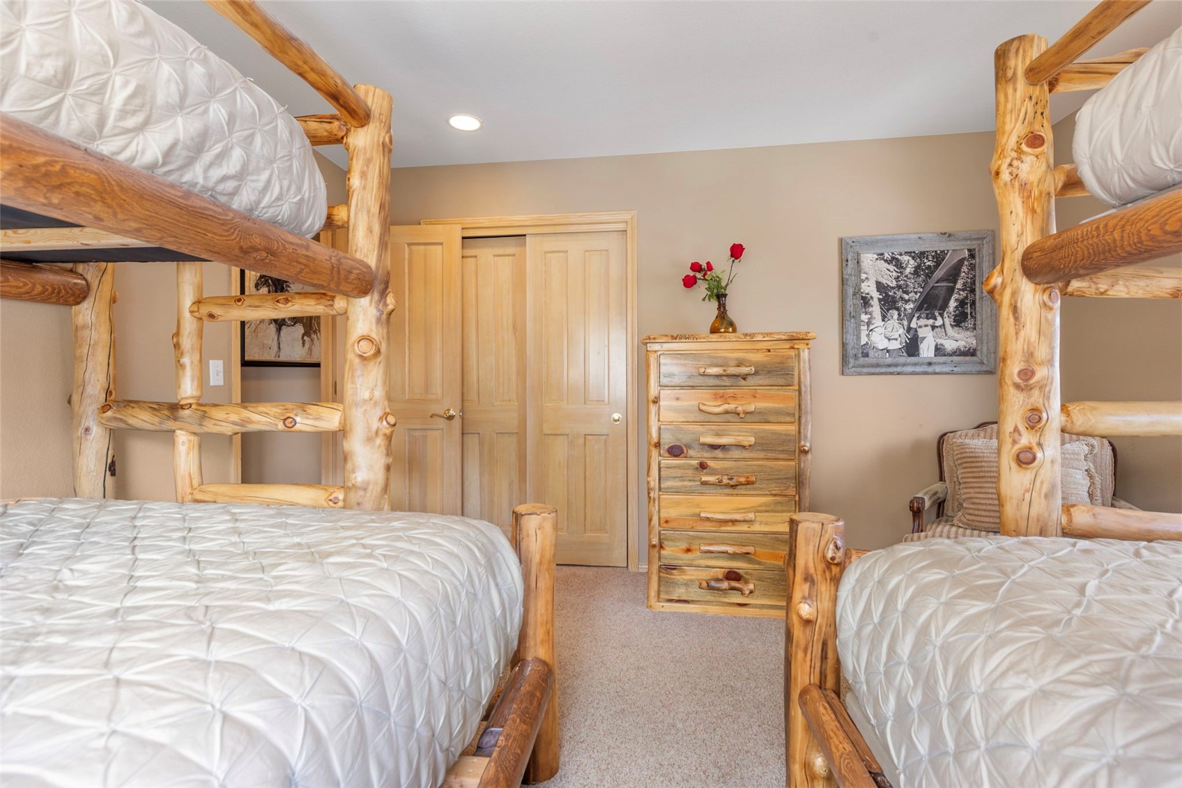 14 Larson Lane, Unit B Frisco, CO 80443 - Photo 21 of 40 a bedroom with a bed and a cabinet