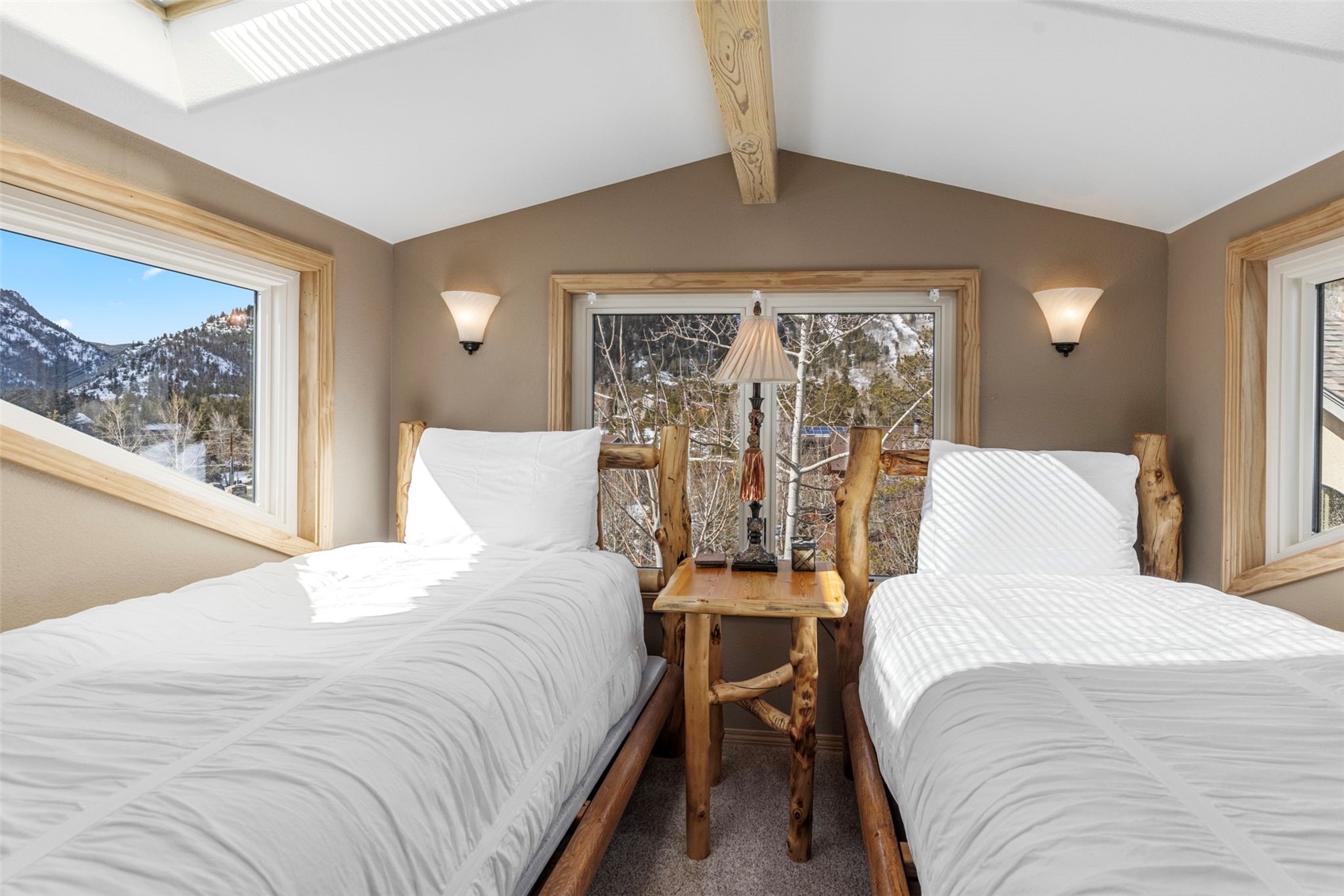 14 Larson Lane, Unit B Frisco, CO 80443 - Photo 25 of 40 a bedroom with a large bed and a window