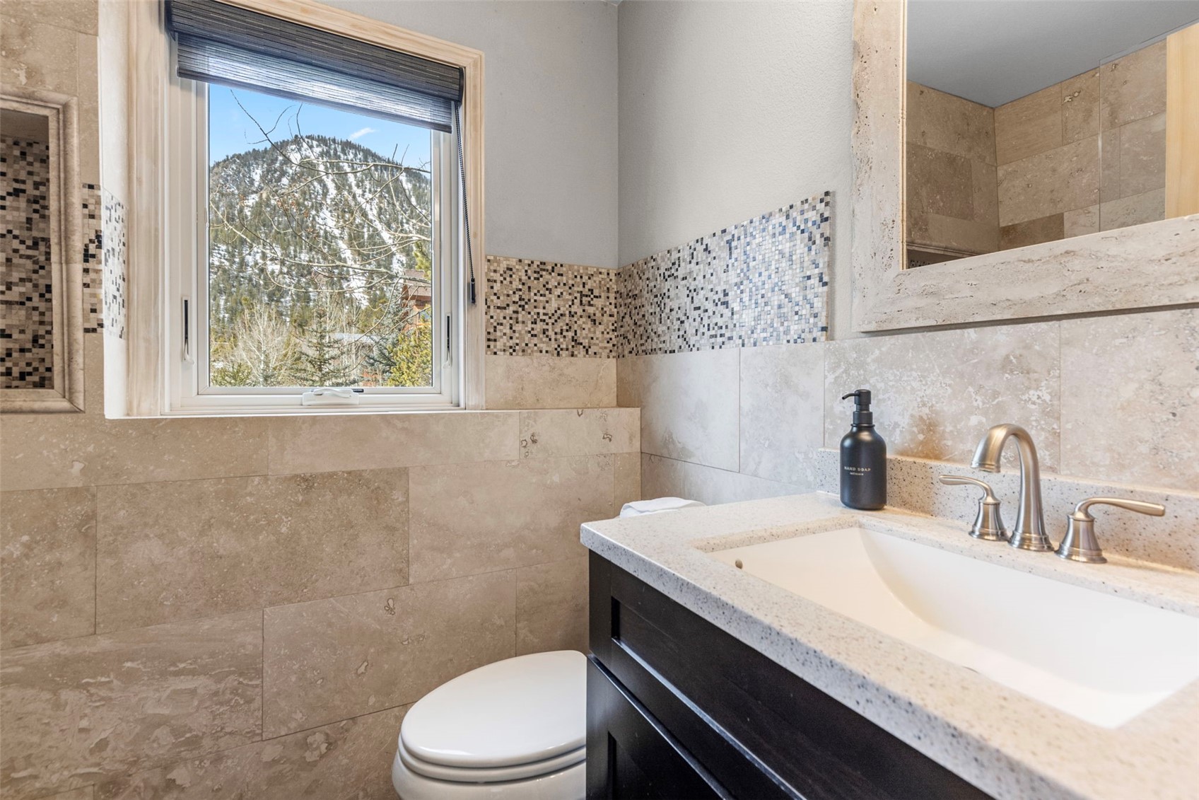 14 Larson Lane, Unit B Frisco, CO 80443 - Photo 34 of 40 a bathroom with a sink a toilet and a window
