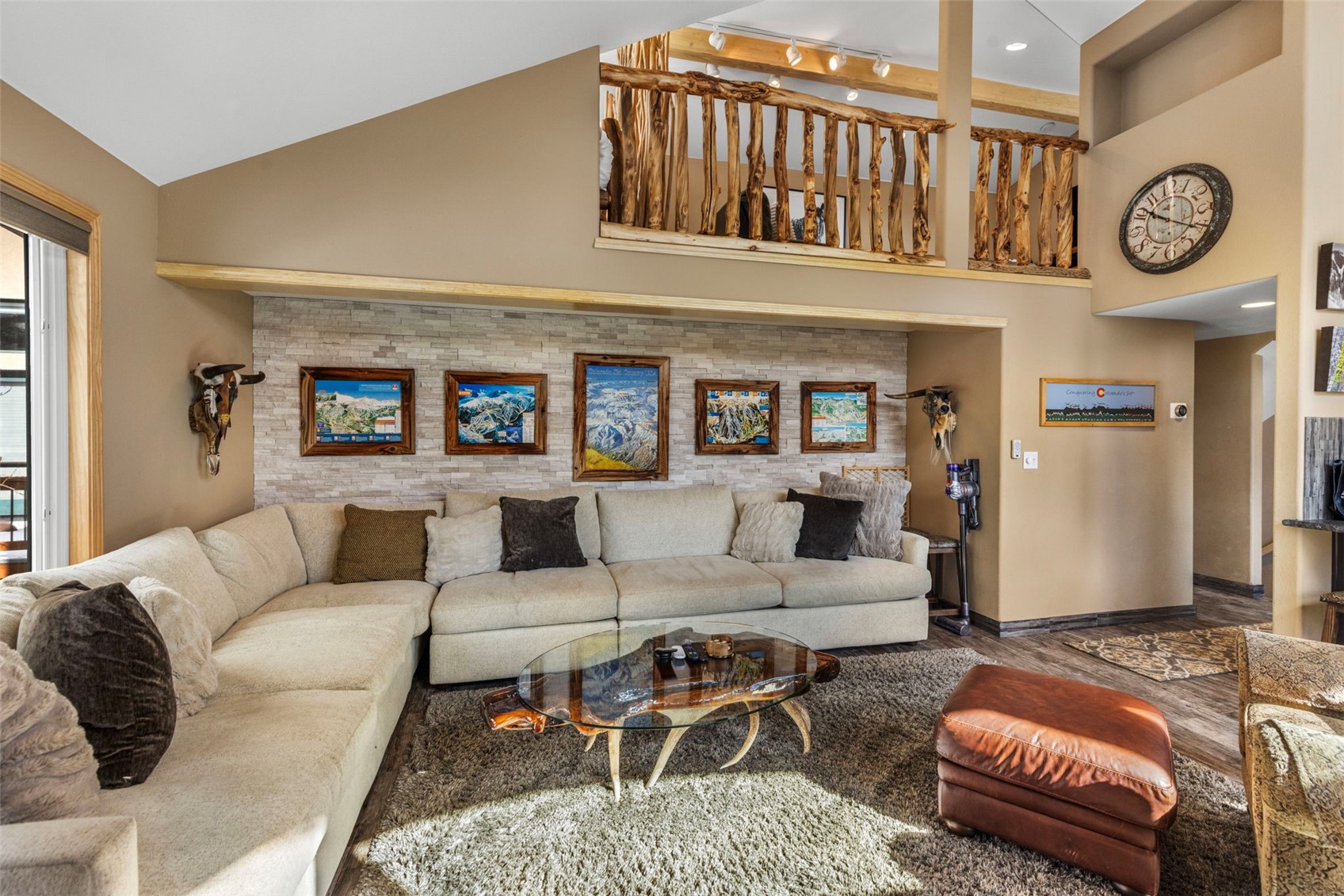 14 Larson Lane, Unit B Frisco, CO 80443 - Photo 4 of 40 a living room with furniture a clock and a table