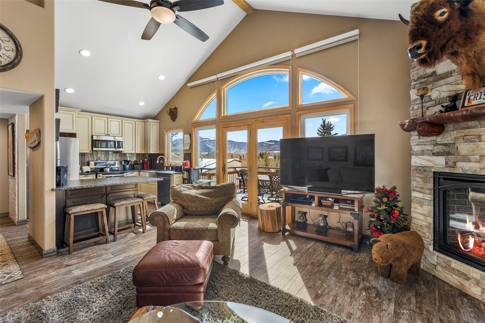 14 Larson Lane, Unit B Frisco, CO 80443 - Photo 5 of 40 a living room with fireplace furniture and a flat screen tv