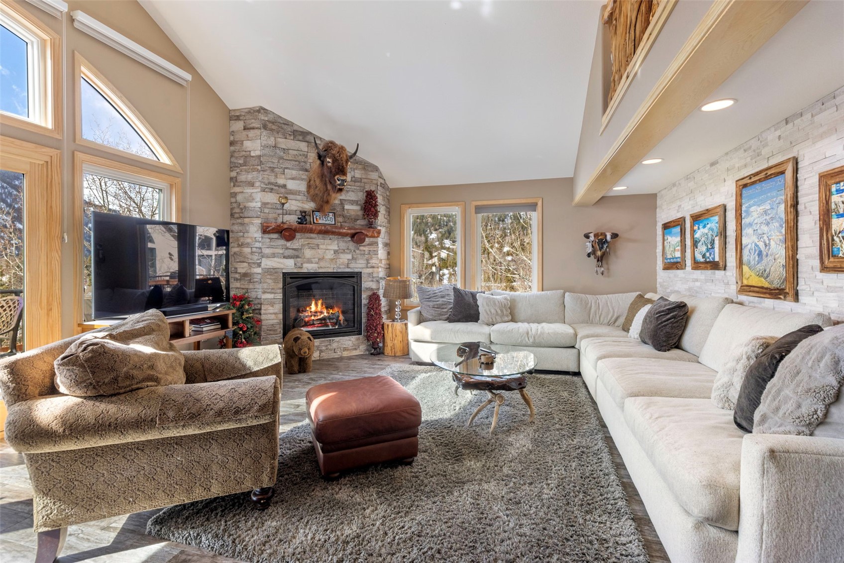 14 Larson Lane, Unit B Frisco, CO 80443 - Photo 6 of 40 a living room with furniture a flat screen tv and a fireplace