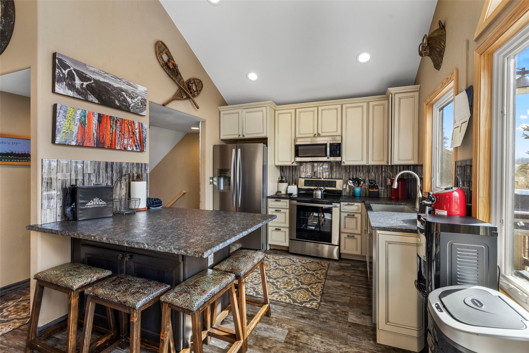 14 Larson Lane, Unit B Frisco, CO 80443 - Photo 7 of 40 a kitchen with a stove a sink and a refrigerator