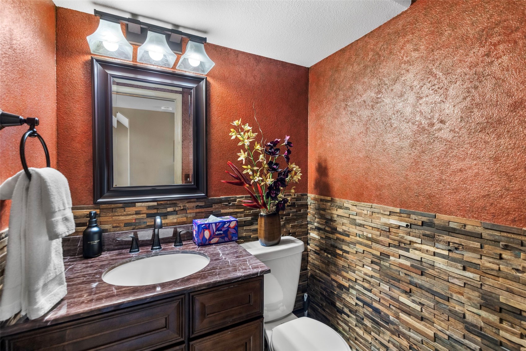14 Larson Lane, Unit B Frisco, CO 80443 - Photo 10 of 40 a bathroom with a granite countertop sink vanity mirror and toilet