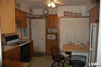 214 East Garrison Street Bethlehem, PA 18018 - Photo 7 of 11 a bathroom with a sink a stove a refrigerator and a refrigerator