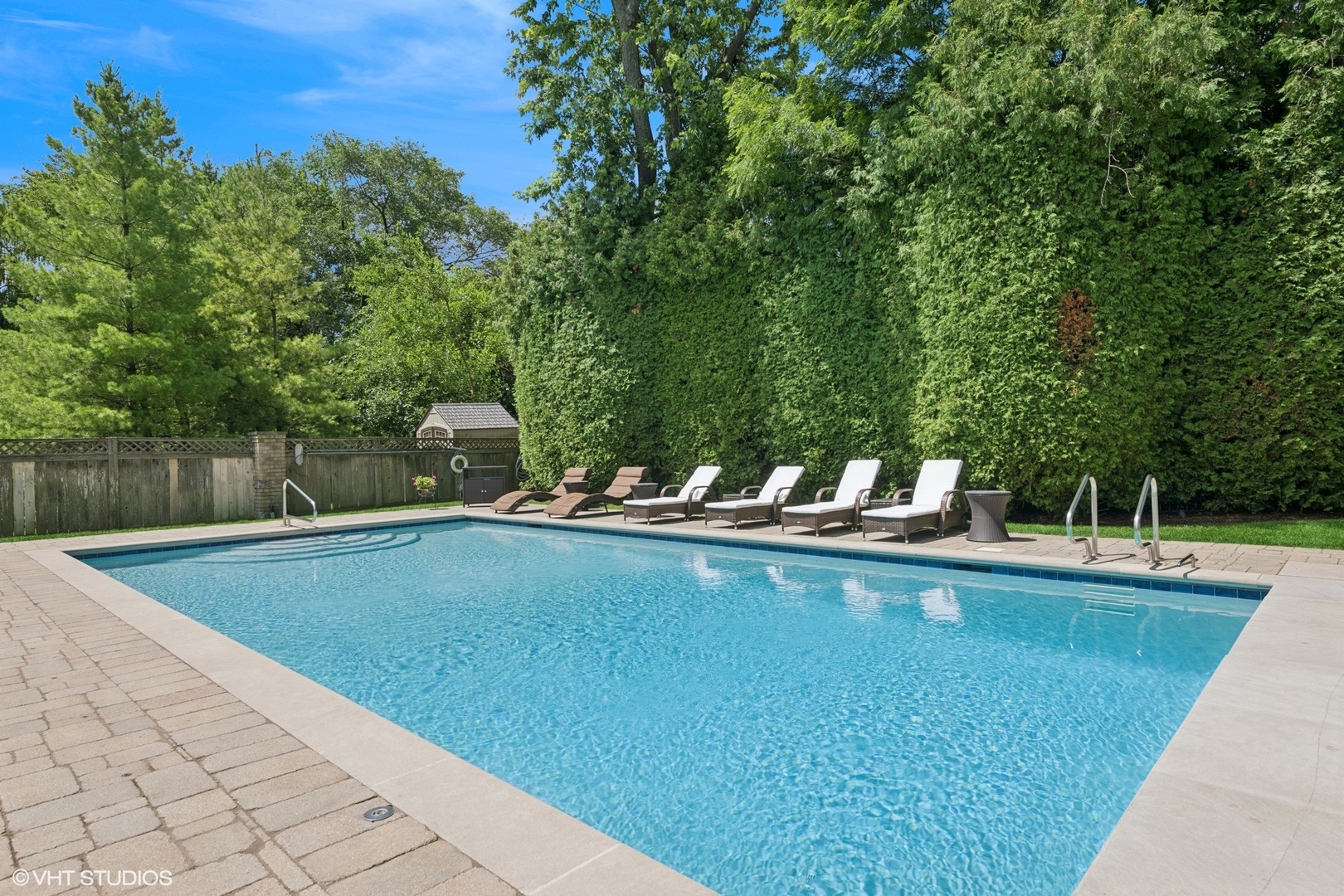 700 Greenwood Road Northbrook, IL 60062 - Photo 64 of 81 a view of a swimming pool with a lawn chairs
