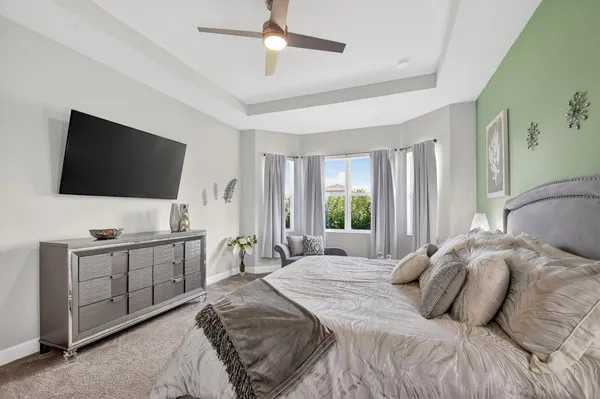 a bedroom with a bed and a table