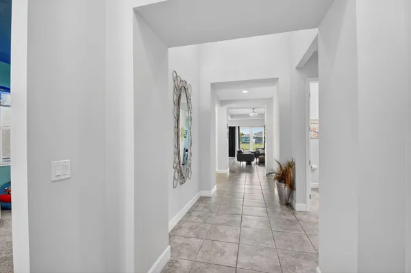 a view of an entryway with wooden floor