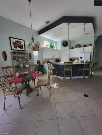 a living room with lots of furniture and a clock