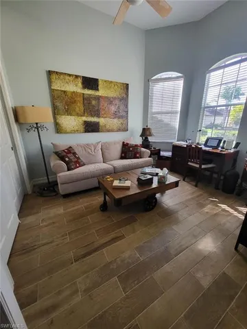 a living room with furniture and a window