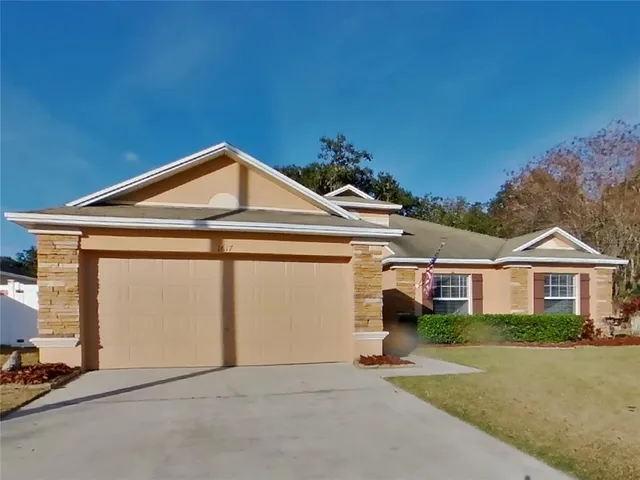 a front view of a house with a garage