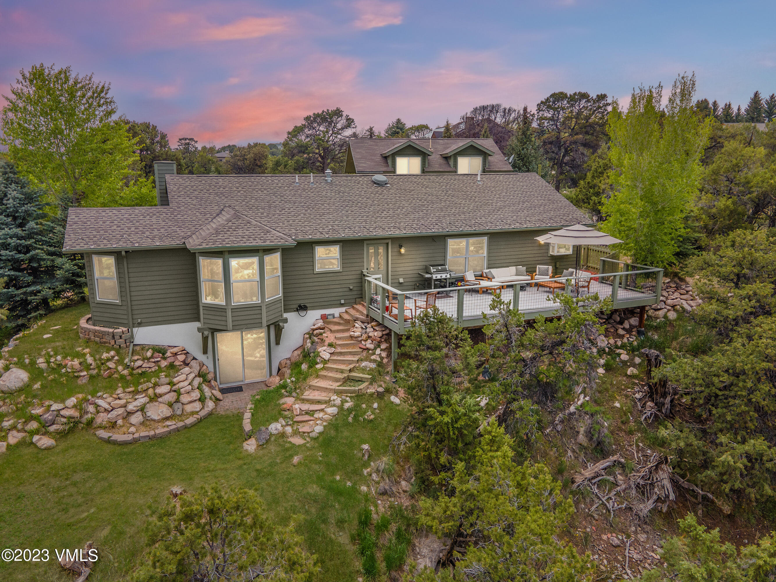 686 Mesa Drive Eagle, CO 81631 - Photo 1 of 73 a front view of a house with garden
