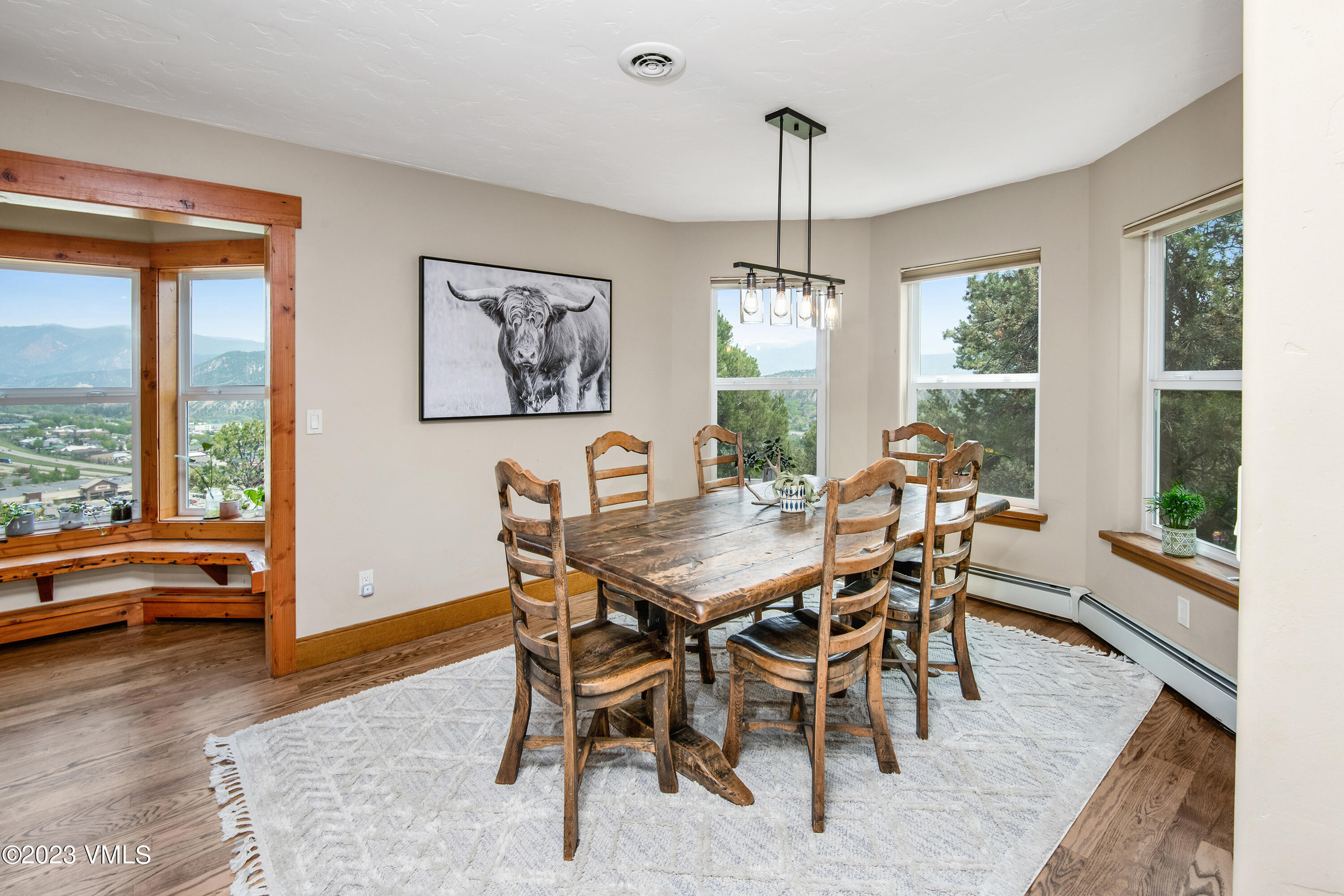 686 Mesa Drive Eagle, CO 81631 - Photo 11 of 73 a view of a dining room with furniture window and wooden floor