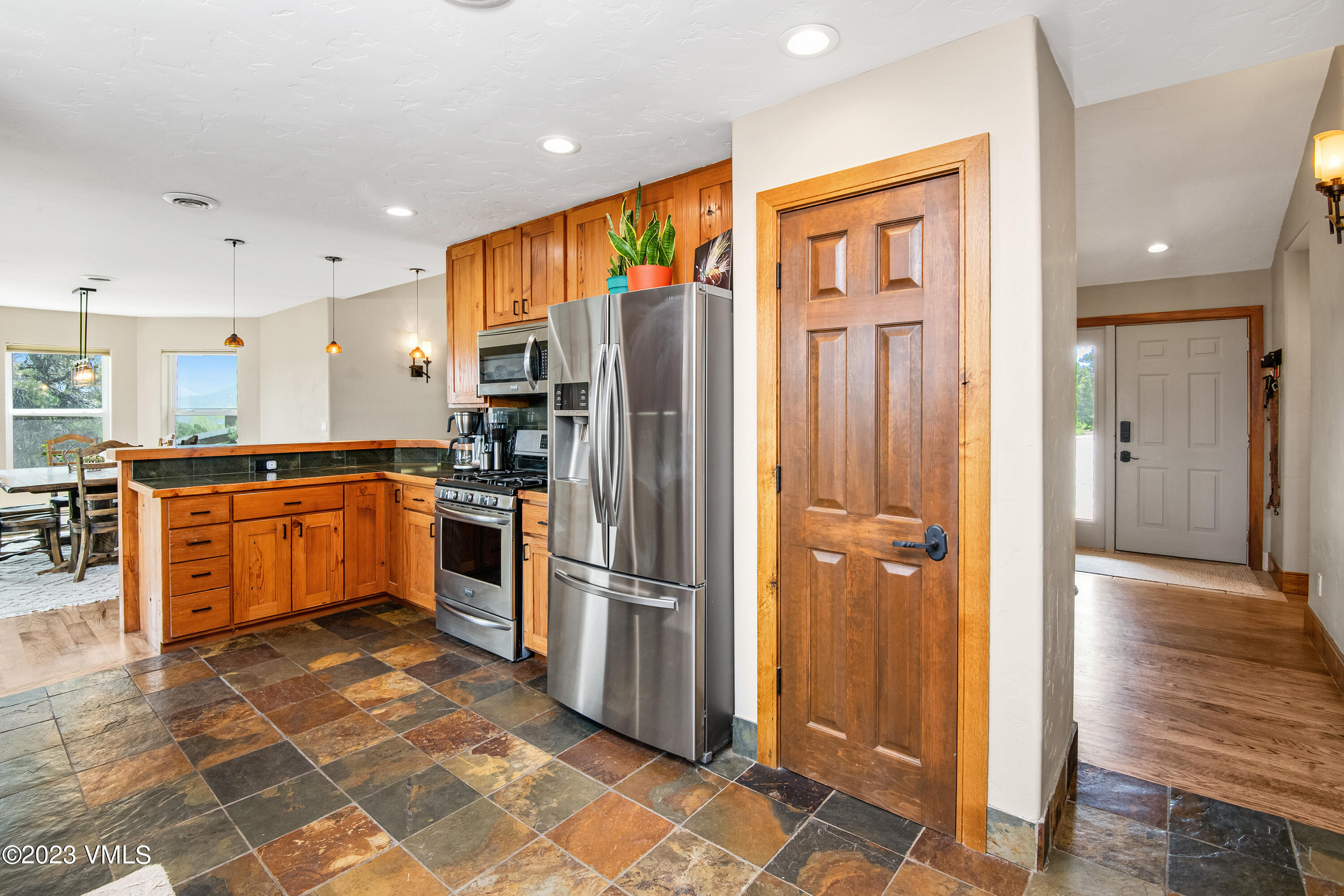 686 Mesa Drive Eagle, CO 81631 - Photo 13 of 73 a kitchen with stainless steel appliances granite countertop a refrigerator and a stove top oven