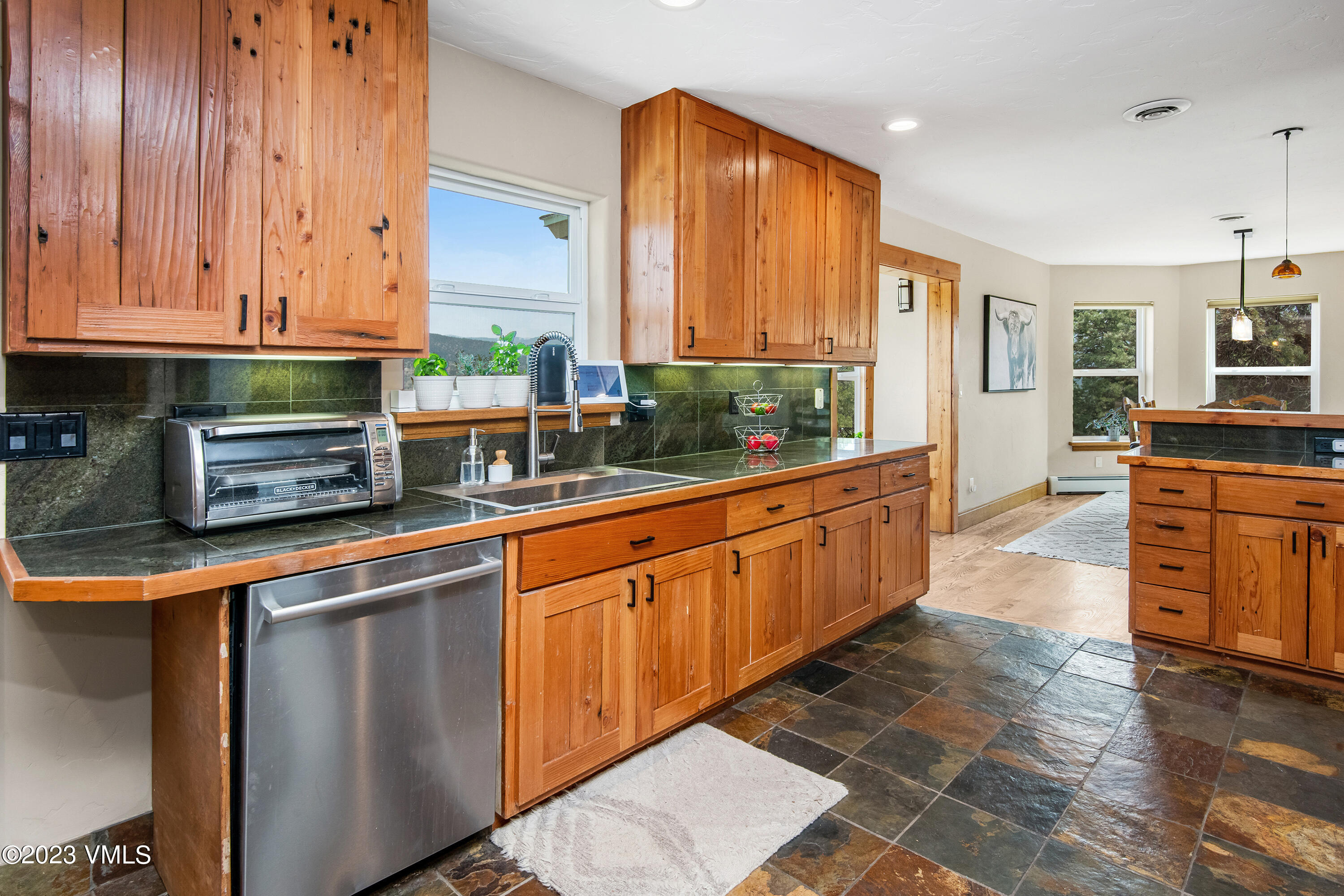 686 Mesa Drive Eagle, CO 81631 - Photo 17 of 73 a kitchen with stainless steel appliances granite countertop a stove a sink and a microwave