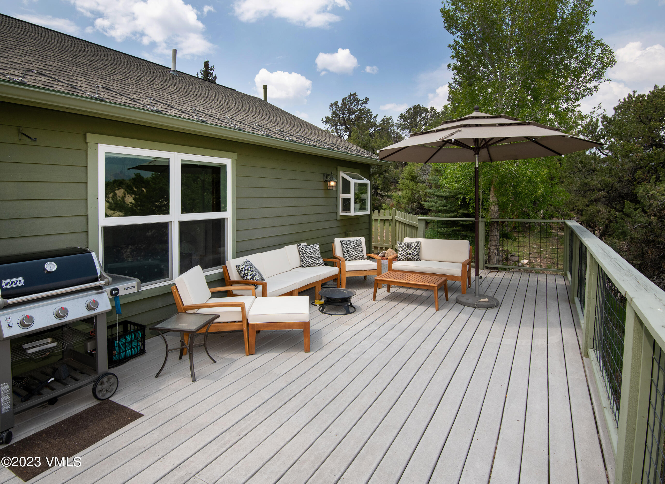 686 Mesa Drive Eagle, CO 81631 - Photo 20 of 73 a backyard of a house with wooden floor barbeque oven and outdoor seating