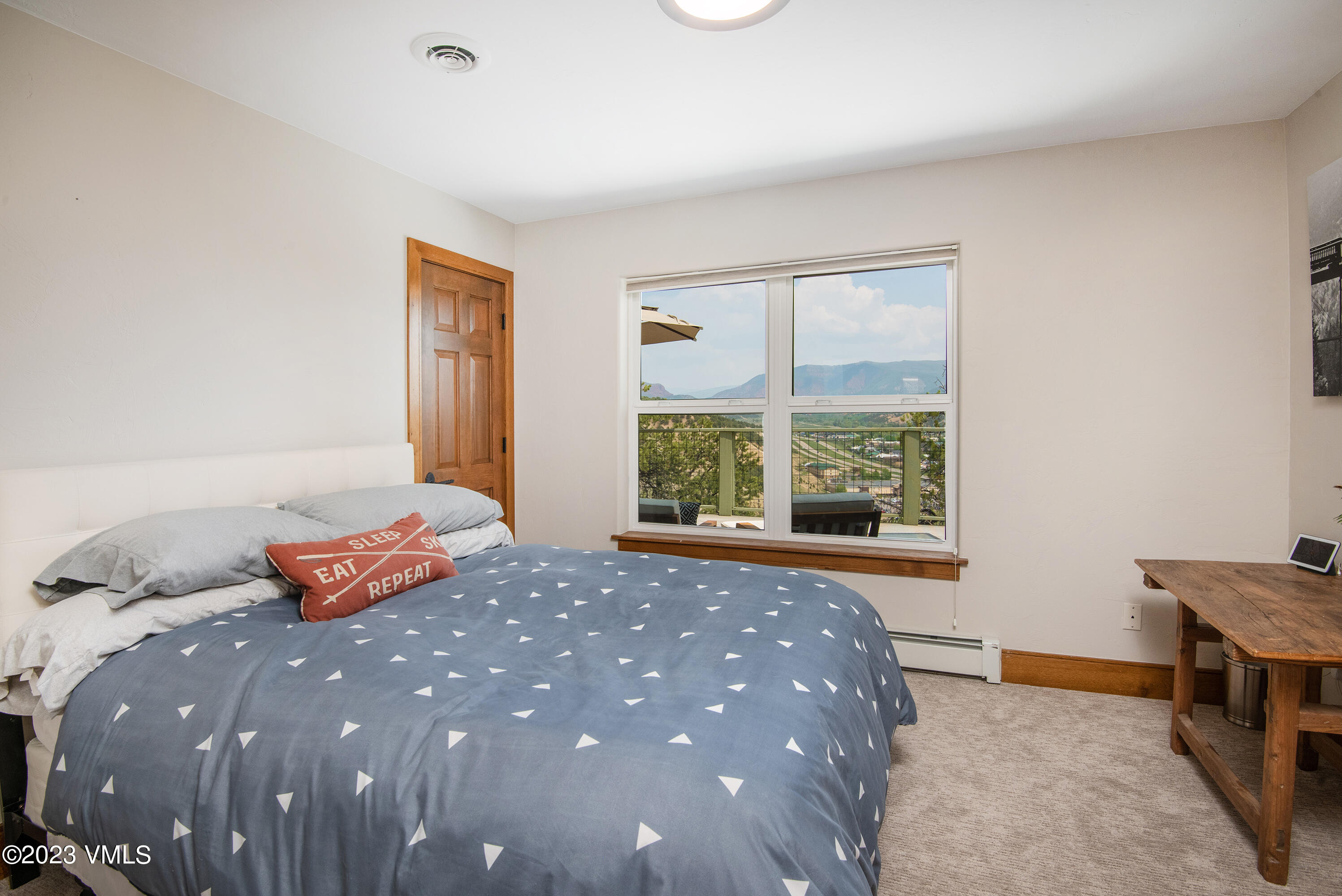 686 Mesa Drive Eagle, CO 81631 - Photo 30 of 73 a bedroom with a bed and window