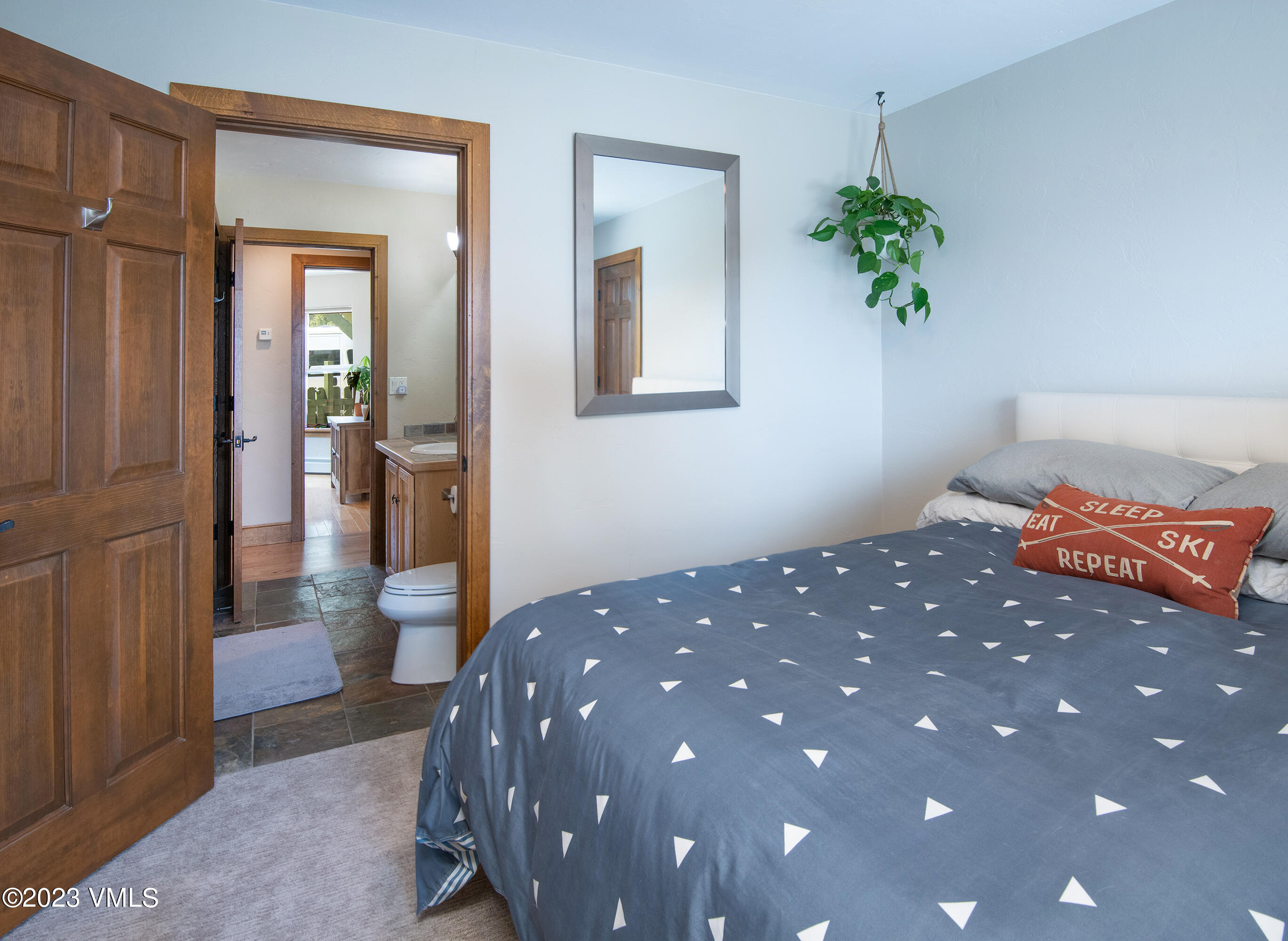 686 Mesa Drive Eagle, CO 81631 - Photo 31 of 73 a bedroom with a bed and a potted plant